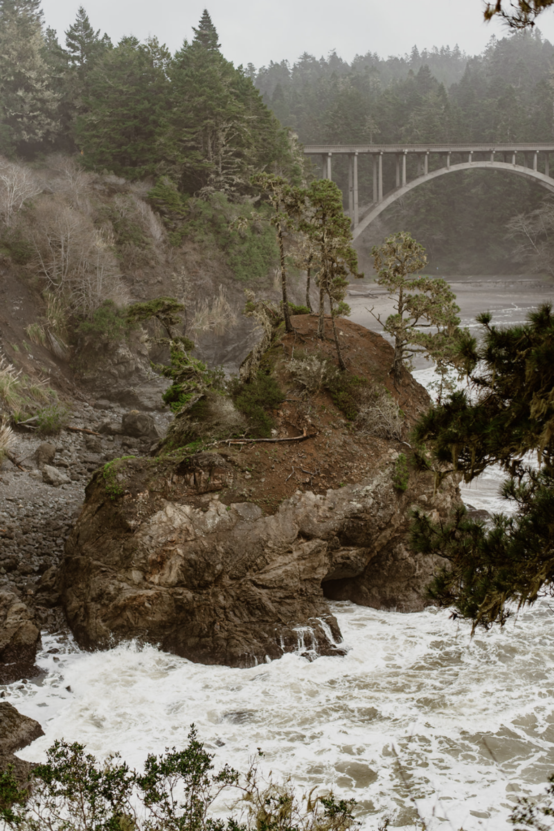 Mendocino's dramatic coastline at Russian Gulch State Park is a perfect backdrop for an elopement. Here's exactly how to plan an elopement there, from an expert.