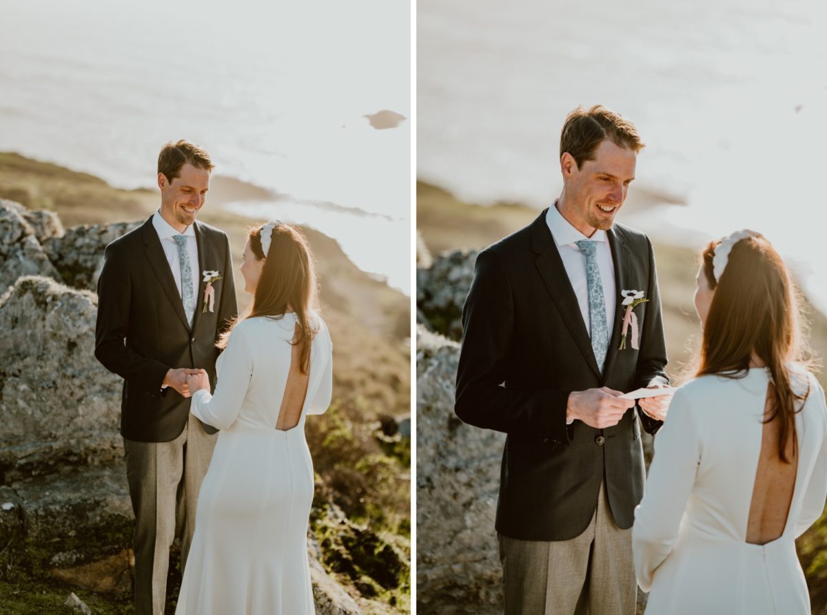 A man holds his wedding vows in both hands and reads them aloud to his wife during their wedding ceremony on the Sonoma coast.