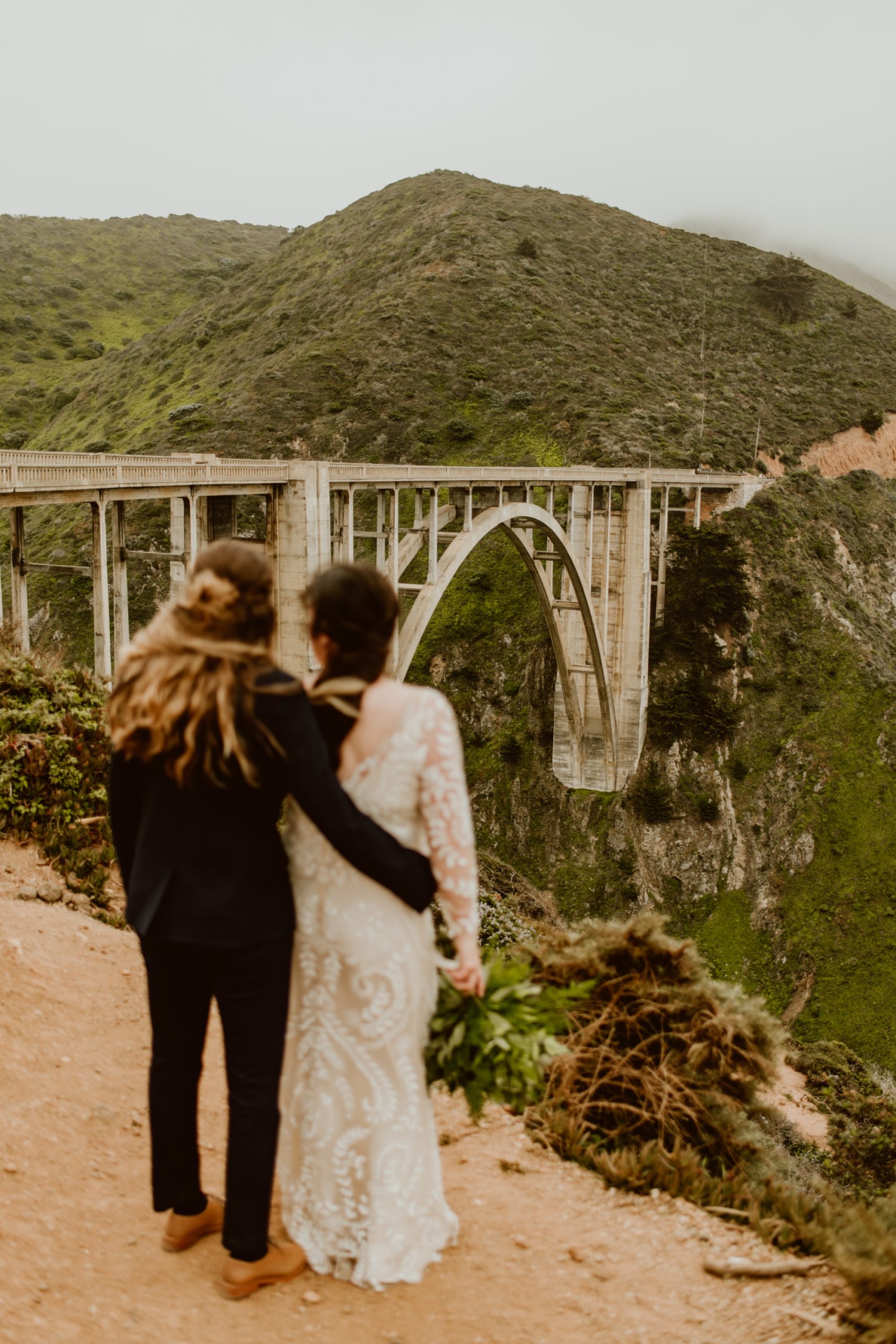 After COVID cancelled their wedding, Jillian and Shay opted into a Big Sur elopement with a stop at Bixby Bridge. You won't want to miss their epic coastal mountaintop photos!